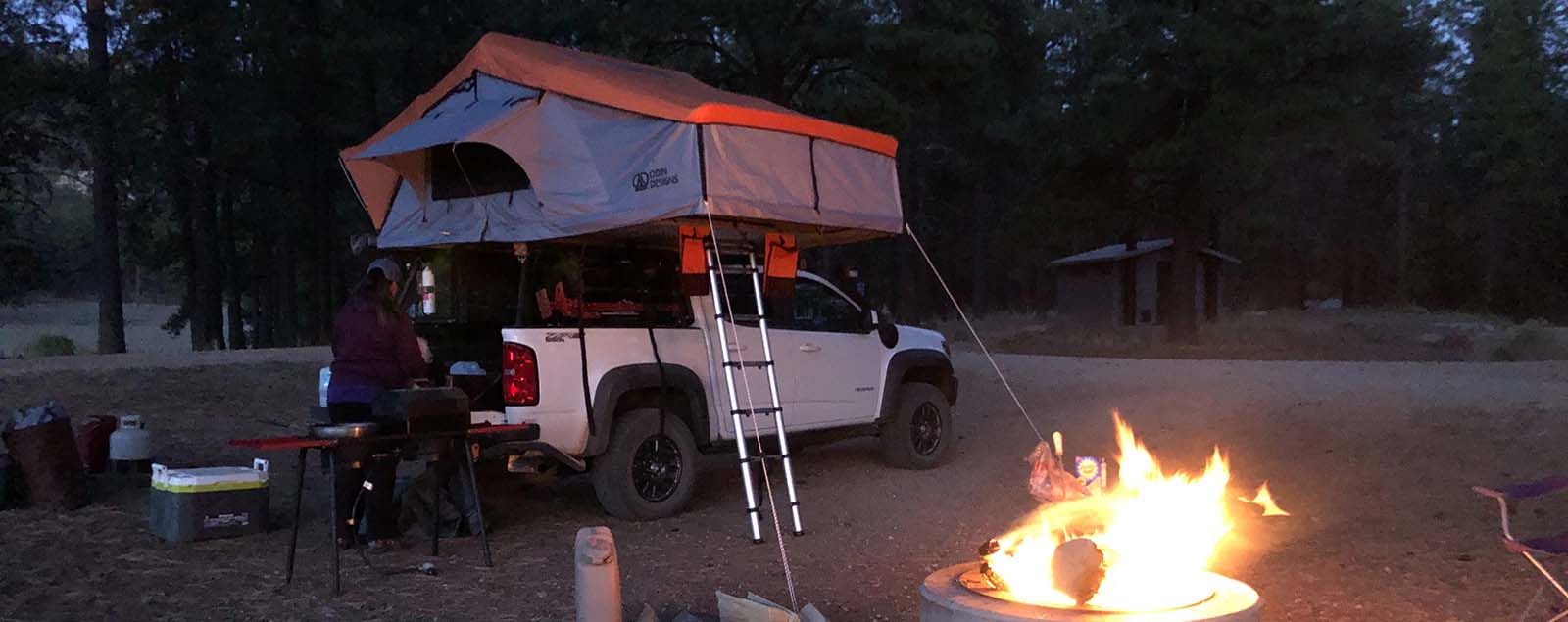 Truck camping near a campfire on the Rimrocker Trail