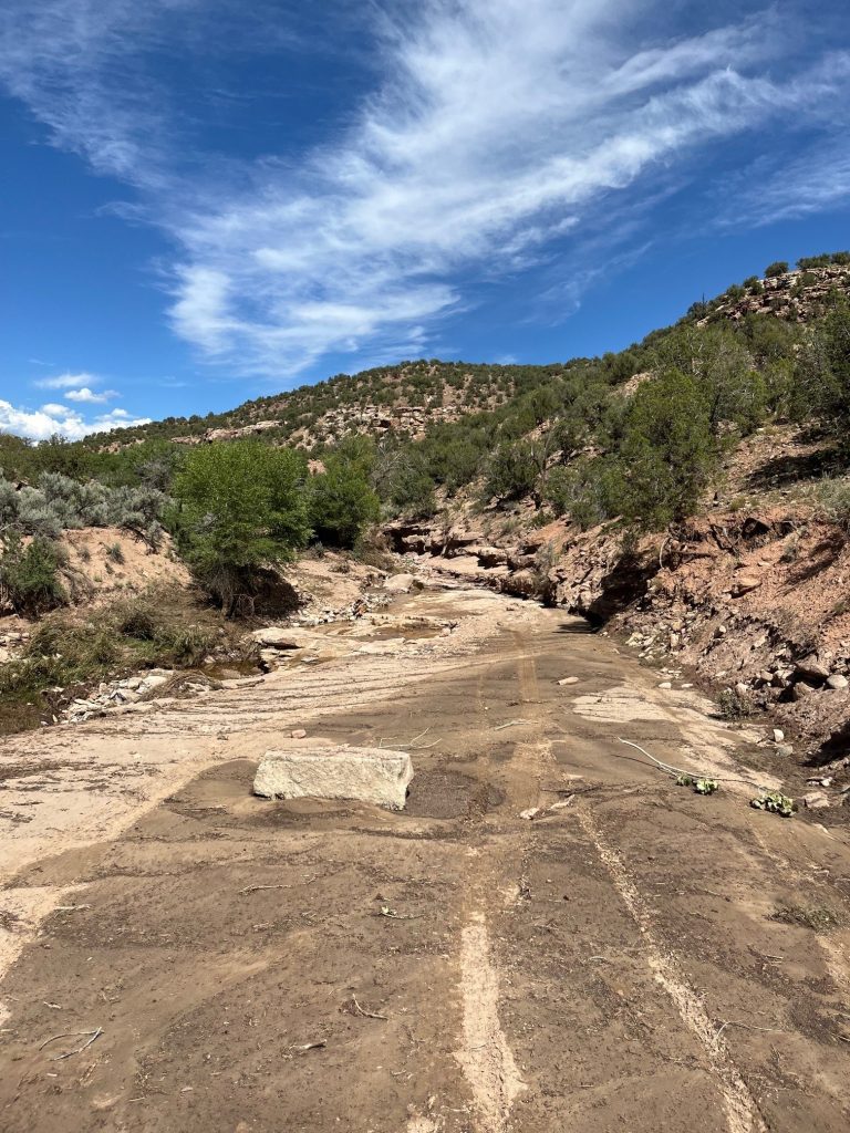 Washed out road with blue skies