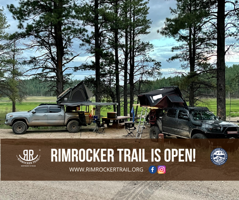 Two camping vehicles showing that the Rimrocker trail is open
